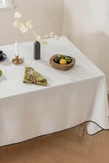 Elegant Off-White Tablecloth with Black Trim, Neutral Tone
